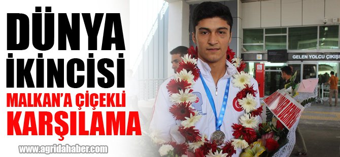 Dünya ikincisi Malkan'a, çiçekli karşılama